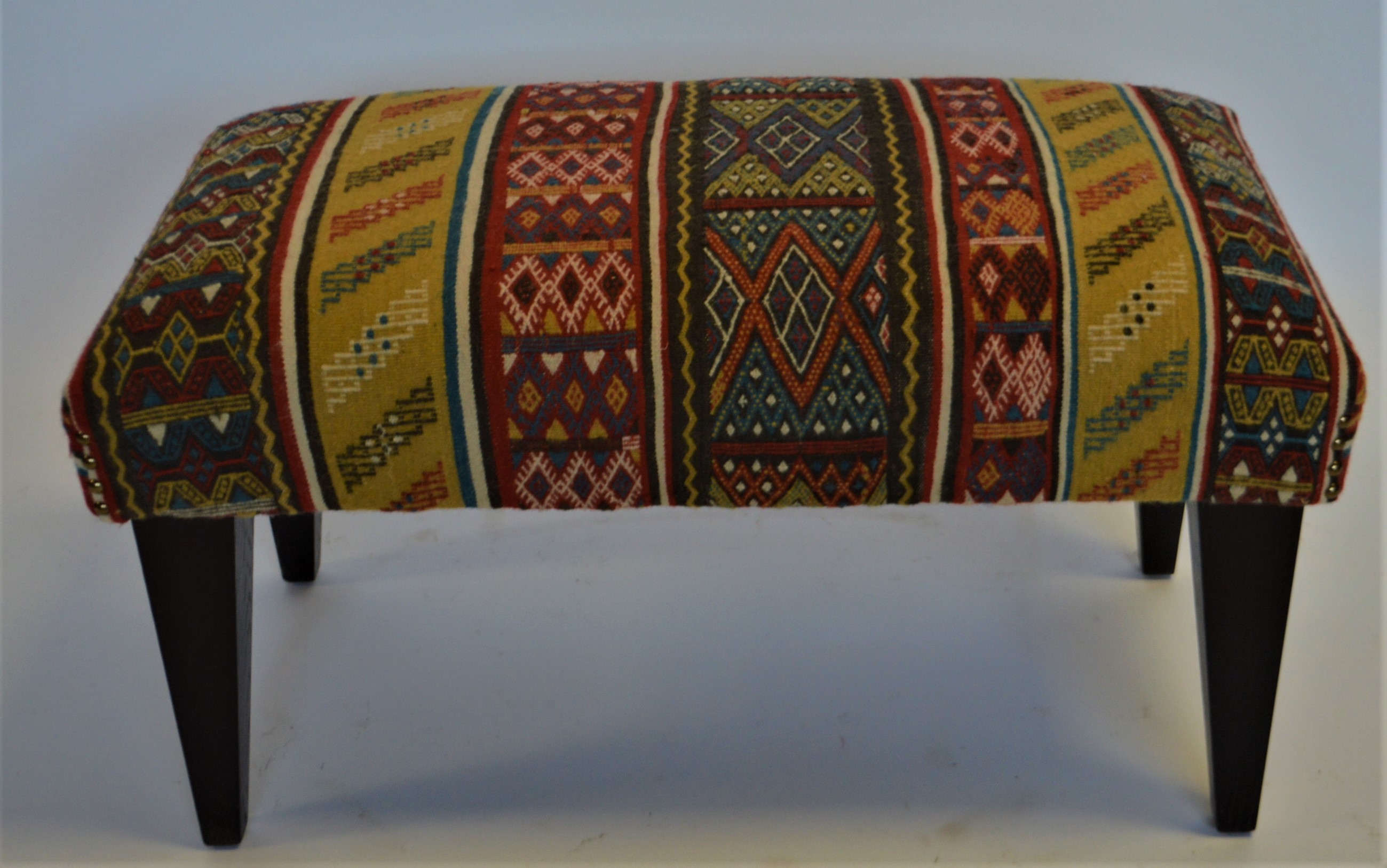 products/ottoman-upholstered-with-a-vintage-hand-made-wool-rug-from-peru..jpg